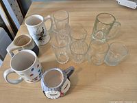 Group view showing all mugs and glasses on tabletop
