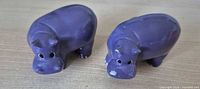 Front view of both purple hippo knobs