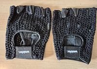 Front view of both gloves showing crochet mesh backs and logo tabs