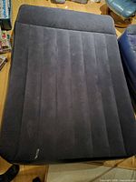 Top view of inflated queen air mattress showing flocked surface and channel design