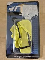 Front of sealed package showing neon yellow leash and RC branding