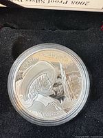 Obverse of encapsulated 2008 Canada silver dollar showing design and condition