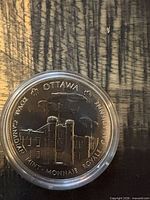Obverse of Ottawa coin showing mint building and legend