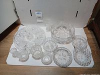 Group shot of all 11 clear cut glass and crystal pieces