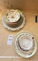 Two stacks showing full quantity and variety of plates and bowls