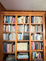 Full bookcase showing multiple shelves packed with books