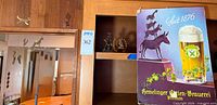 Hemelinger cardboard sign with stacked animal image on shelving