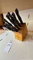 Knives inserted in Cutco wood block showing overall set