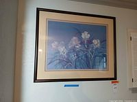 Full view of framed floral print on wall
