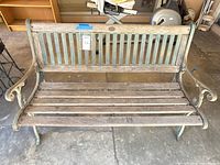 Front view of full bench showing wood slats and metal frame