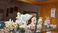 Shelf with full assortment of porcelain pieces