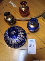 Group shot of all four glass pieces on table