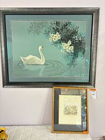 overview of both framed prints on wall