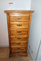 Front view of tallboy chest showing all seven drawers closed