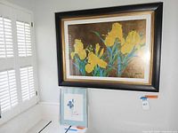 Large yellow iris print and small blue iris print displayed together