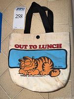 Front of tote with Garfield design and lot tag