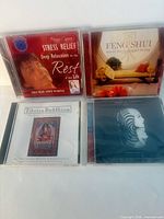 Four CD cases front covers visible