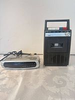 AIWA cassette recorder and Emerson clock radio front view