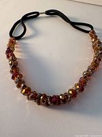 Full view of beaded headband showing bead spacing and elastic loop