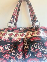 Front view of quilted floral shoulder bag