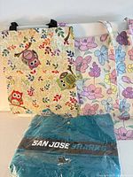 Overall view of all three totes, showing designs and packaged Sharks tote