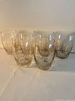 All six glass tumblers standing in a row