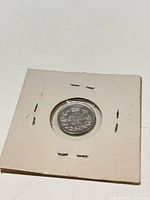 Reverse of 1903 Canada 5 Cents coin inside 2x2 holder