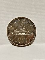 Reverse showing Voyageur canoe design and date 1955
