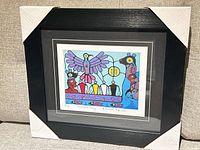 Front view of framed lithograph showing artwork, mats, frame, and corner guards