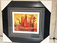 Front view of framed lithograph showing artwork, mat and frame
