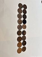 Column of 18 British pennies obverse side