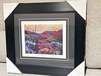 Front view of framed print showing artwork, matting and frame
