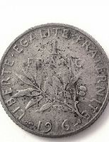 Reverse side showing 1 FRANC denomination, olive branch and 1916 date