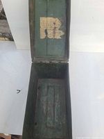 Ammunition box opened showing interior and lid