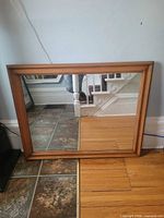 Front view of wood-framed mirror