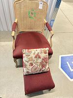 Front view of Bergère chair, cushion, and footstool