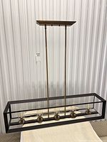 Full view of chandelier showing frame, down-rods, canopy