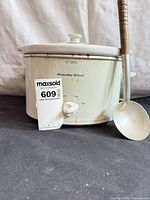 Front view of Proctor Silex slow cooker with ladle