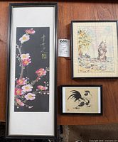Group shot of three framed artworks