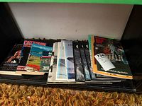 Group view of all books and pamphlets on shelf