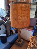 Full view of table lamp with burlap shade on desk
