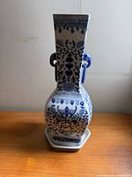 Full view of vase on stand