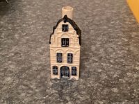 Front view showing façade detail of Delft blue house