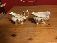 Cream pitcher and sugar bowl side view