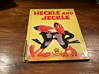 Front cover showing title, characters, spine damage
