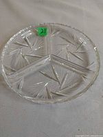 Full view of round three-segment glass dish showing all compartments and pinwheel design