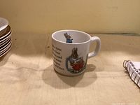 Front view showing Peter Rabbit illustration and handle