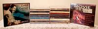 Full lot with two box sets flanking stack of jewel cases
