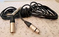 Coiled Digiflex microphone cable showing both XLR connectors, male and female