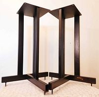 Both black metal Target Audio speaker stands showing four-column design and adjustable spikes.